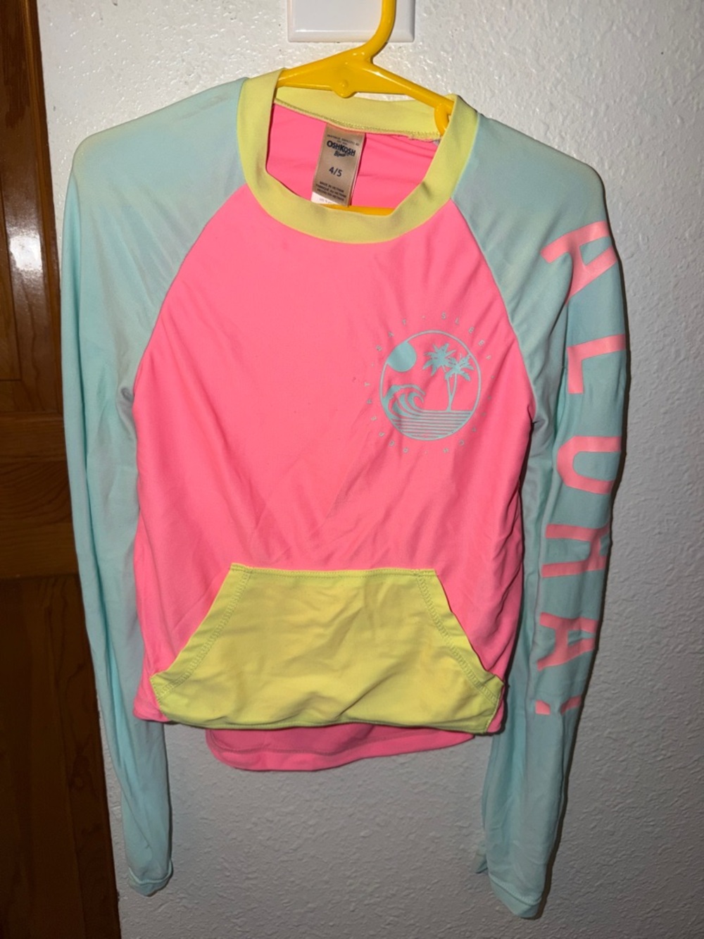 Ocean Current Neon Pink Rash Guard with Aqua Sleeves and Yellow Pocket